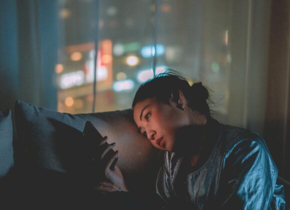 photo of woman using mobile phone